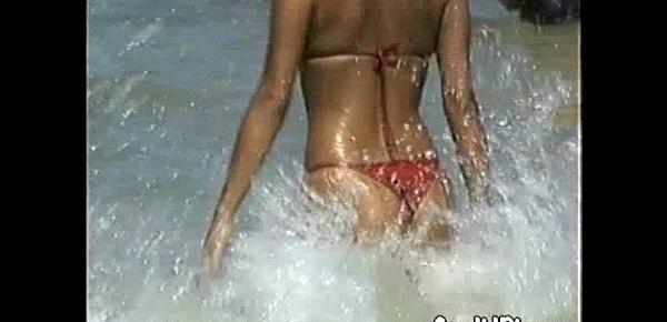  Latina in Bikini Flashes Tits at Beach